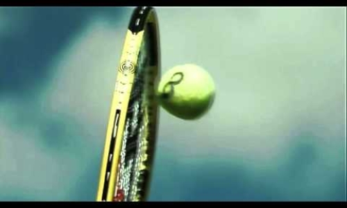 Raquet hits tennis ball in Slo Mo